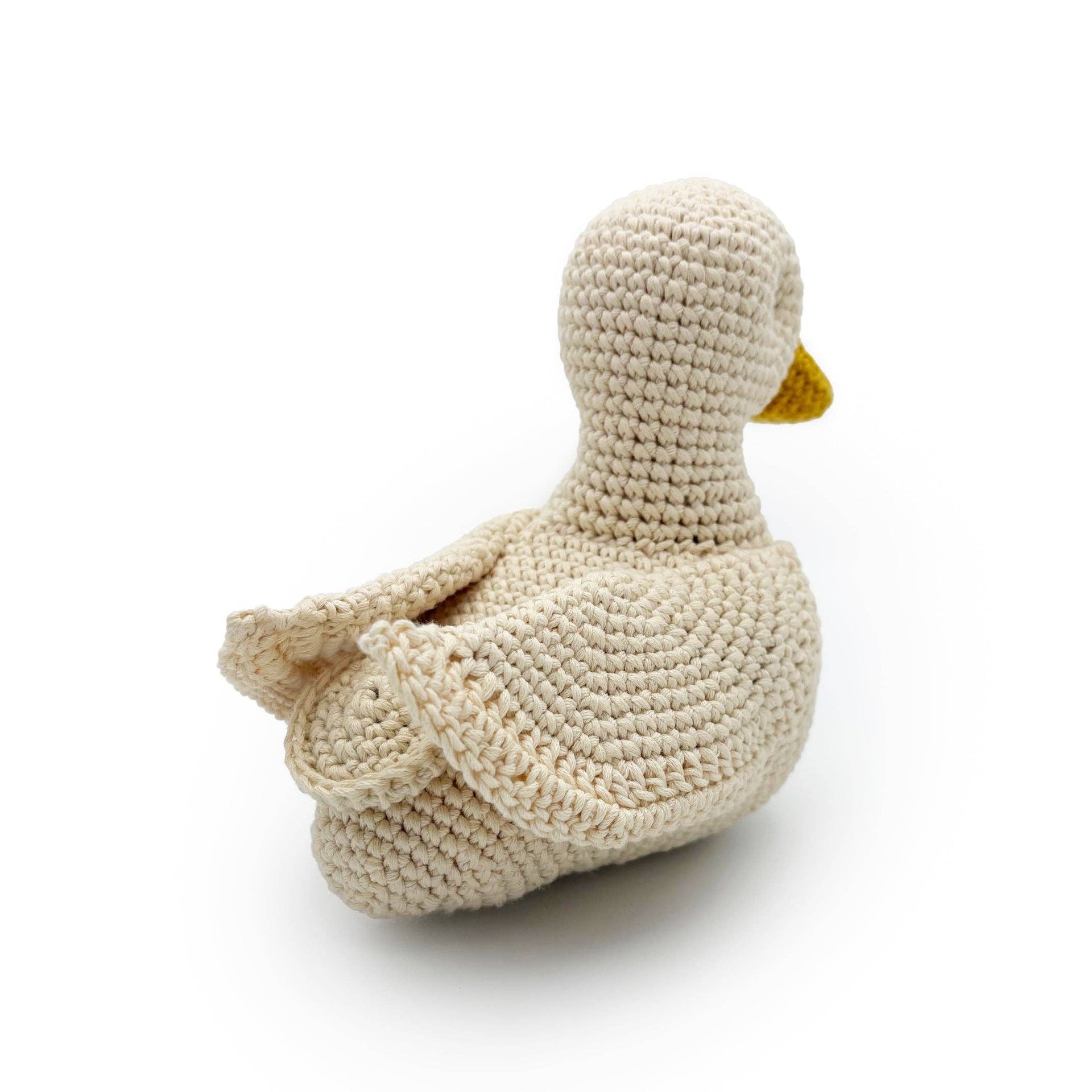 Knitted musical duck plush