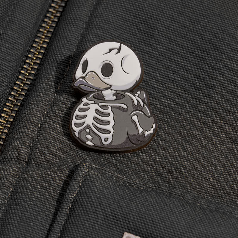 Pin's TUBBZ Numskull – Squelette phosphorescent
