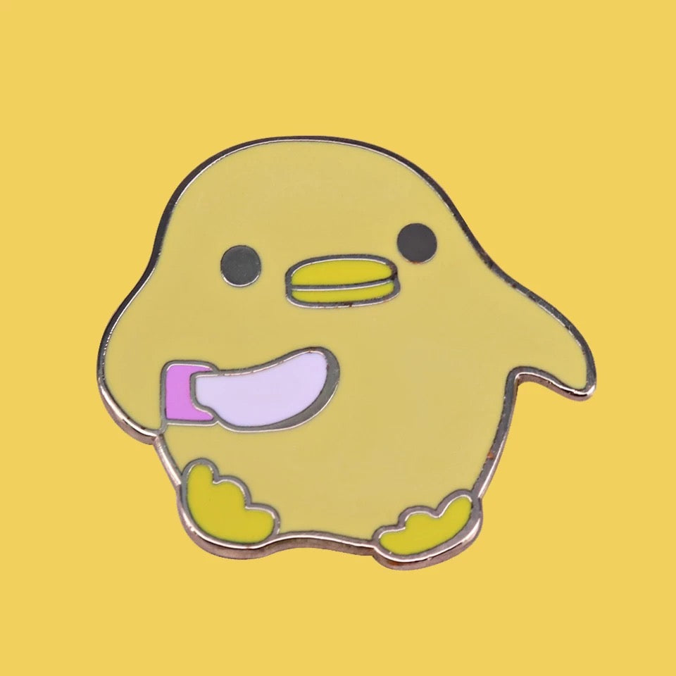Pin’s Canard Jaune avec Couteau